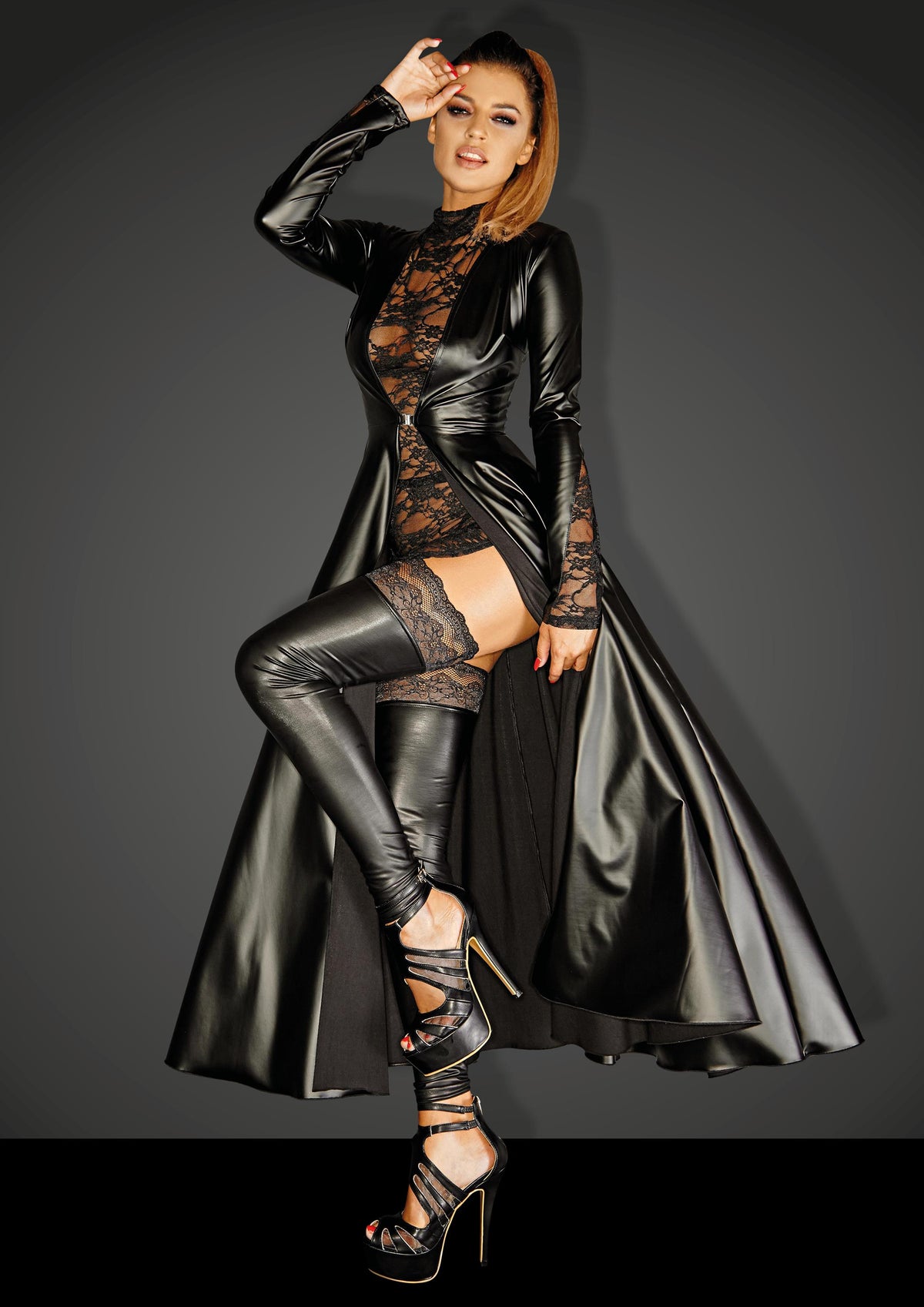 Black wetlook gown coat with lace panels and long flared skirt, front view.